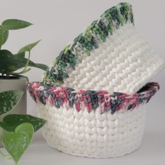 Two completed springtime crochet baskets made with tshirt yarn.